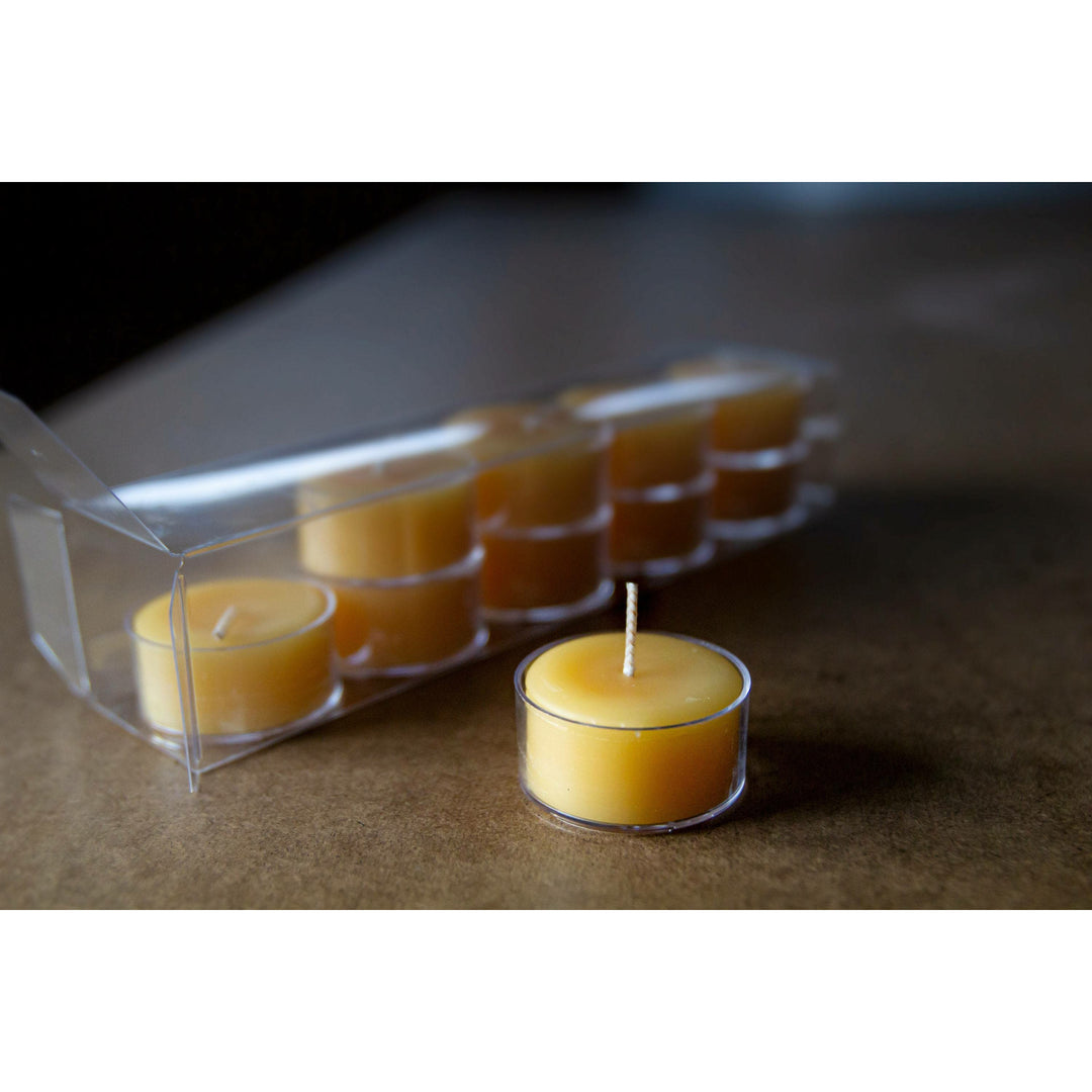 Tealights on a table. One out of box.