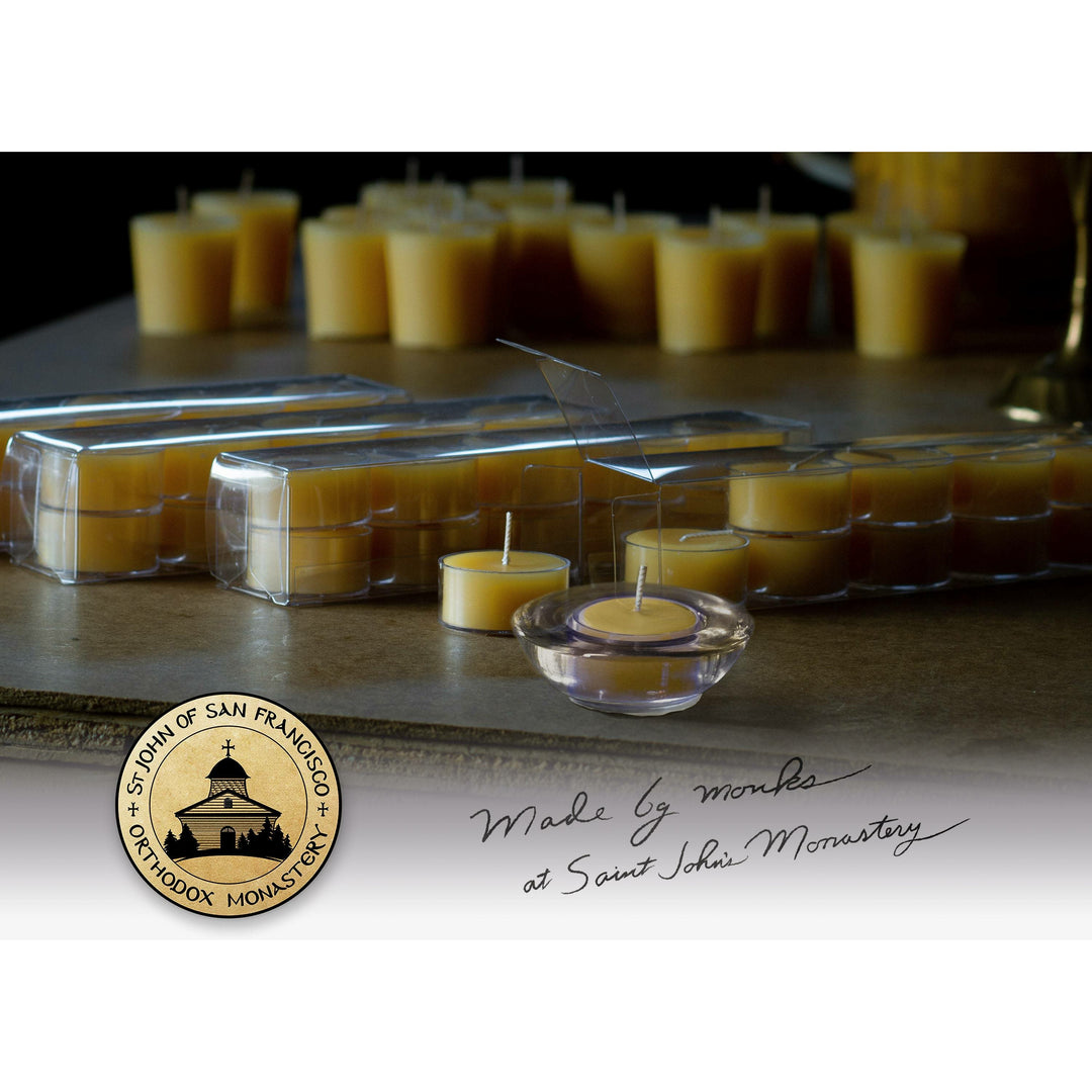 Boxed and unboxed tealights on a table - Made by monks at Saint John's monastery.