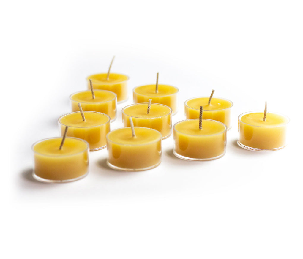 10 Tealights on white background.