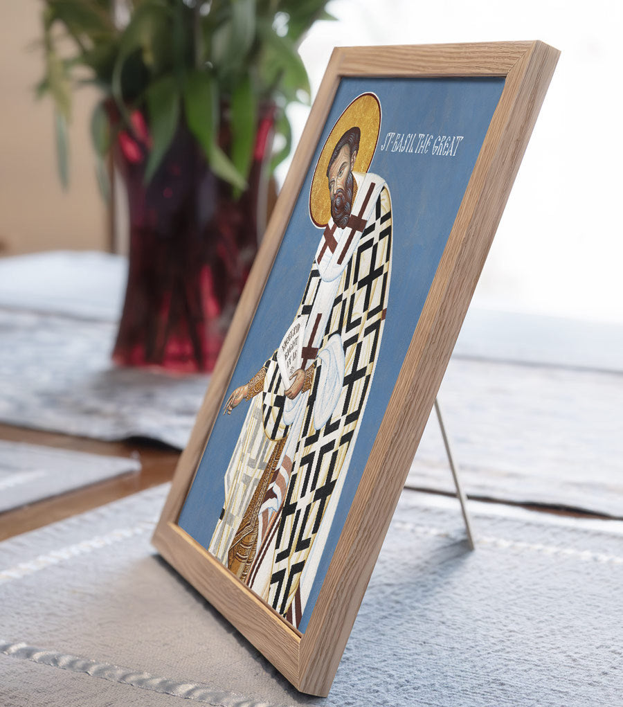 Framed religious icon on a table with a blurred background