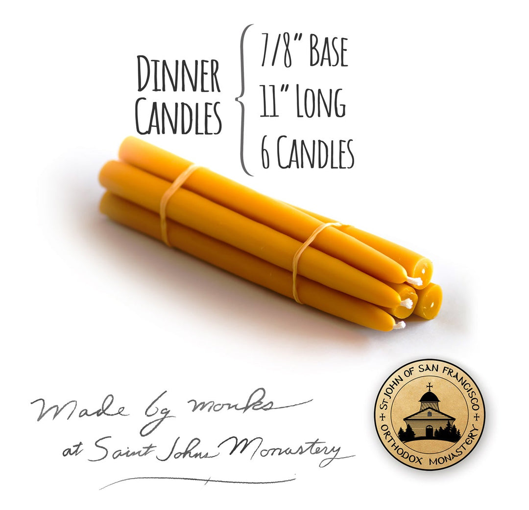 A bundle of 11" long 100% Pure beeswax candles, dinner candles, 7/8 inches wide with st. john's monastery logo